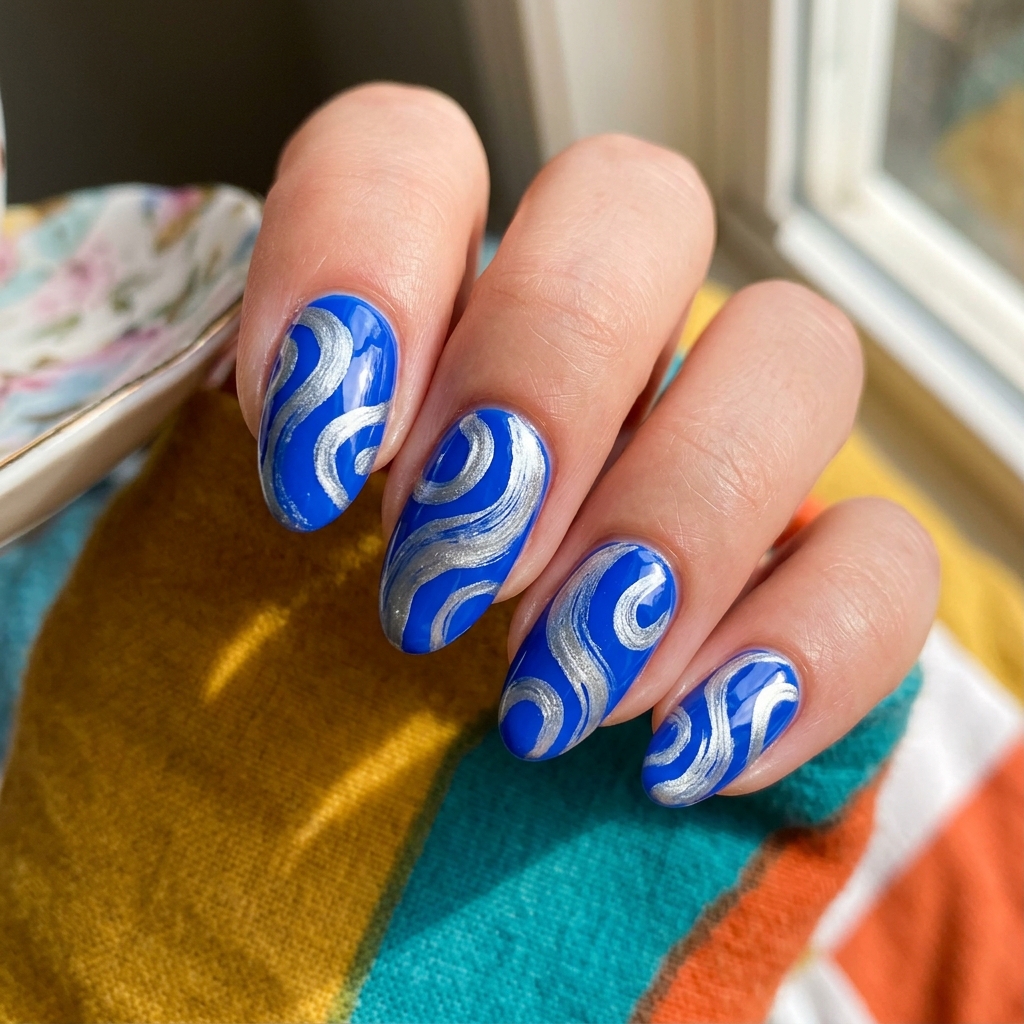 Blue and Silver Nail Designs Ideas: 30 Stunning Looks to Try Now 22 Blue and Silver Swirl Nail Design Ideas