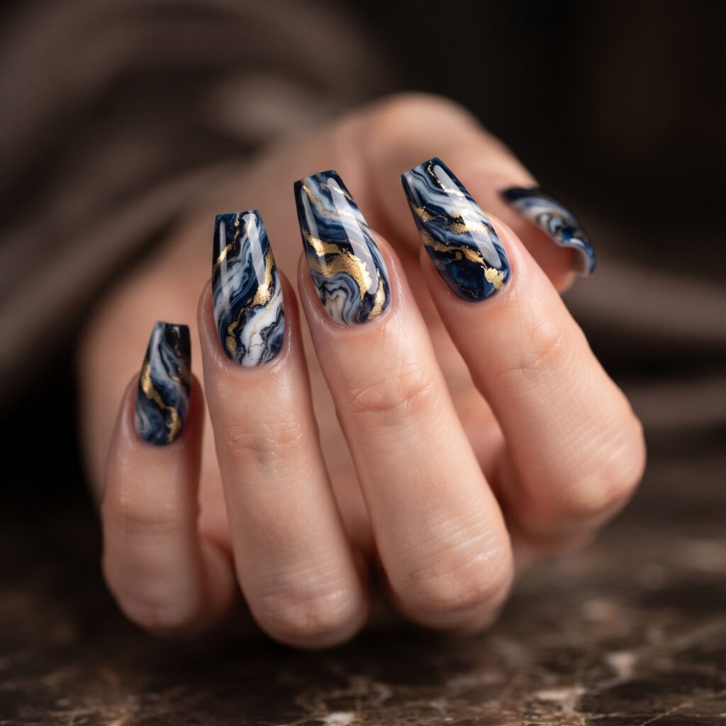Dark Blue Nails Ideas: 30 Stunning Looks to Inspire Your Next Manicure 21 Dark Blue Marble Swirl Nails Idea